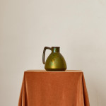 An iridescent glazed cermic jug by Montières Pottery