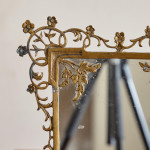 An Aesthetic movement gilt bronze easel mirror