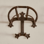 A collection of seven patinated wrought iron bridle hooks originally from Middleton Park, Oxfordshire