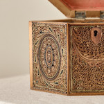 A George III scrolled paper tea caddy