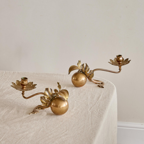 A pair of Arts & Crafts brass candlesticks after a design by W.A.S Benson