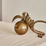 A pair of Arts & Crafts brass candlesticks after a design by W.A.S Benson