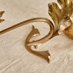 A pair of Arts & Crafts brass candlesticks after a design by W.A.S Benson