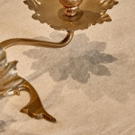 A pair of Arts & Crafts brass candlesticks after a design by W.A.S Benson