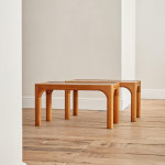 A pair of rectangular teak and leather low tables