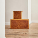 A pair of rectangular teak and leather low tables