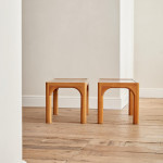 A pair of rectangular teak and leather low tables