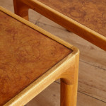 A pair of rectangular teak and leather low tables