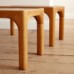 A pair of rectangular teak and leather low tables