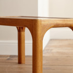 A pair of rectangular teak and leather low tables