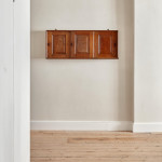 An Arts & Crafts Cotswold School chestnut wall-mounted cabinet possibly by Sir Gordon Russell (1892 - 1980)