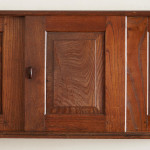 An Arts & Crafts Cotswold School chestnut wall-mounted cabinet possibly by Sir Gordon Russell (1892 - 1980)