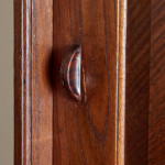 An Arts & Crafts Cotswold School chestnut wall-mounted cabinet possibly by Sir Gordon Russell (1892 - 1980)