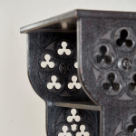 A small Gothic Revival ebonised oak hanging shelf