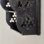 A small Gothic Revival ebonised oak hanging shelf