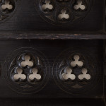 A small Gothic Revival ebonised oak hanging shelf