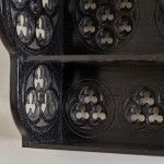 A small Gothic Revival ebonised oak hanging shelf