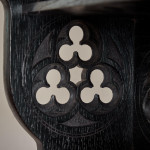 A small Gothic Revival ebonised oak hanging shelf