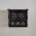 A small Gothic Revival ebonised oak hanging shelf