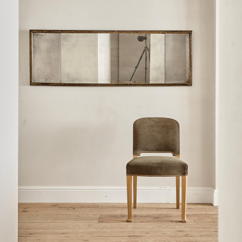 A George III ebonised and parcel gilt triple-plate overmantle mirror