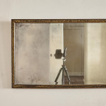 A George III ebonised and parcel gilt triple-plate overmantle mirror