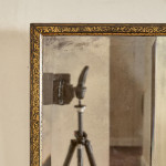 A George III ebonised and parcel gilt triple-plate overmantle mirror