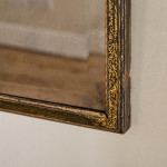 A George III ebonised and parcel gilt triple-plate overmantle mirror