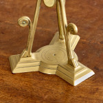 A pair of Aesthetic Movement brass candlesticks