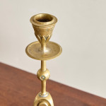 A pair of Aesthetic Movement brass candlesticks