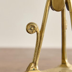 A pair of Aesthetic Movement brass candlesticks