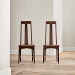 A pair of Arts and Crafts stained oak high back side chairs