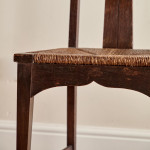 A pair of Arts and Crafts stained oak high back side chairs