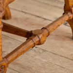 A Reformed Gothic oak upholstered side chair covered in the original red leather