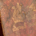 A Reformed Gothic oak upholstered side chair covered in the original red leather