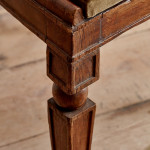 A pair of Regency oak hall chairs in the manner of George Bullock (1777-1818)