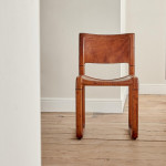 A pair of early leather clad side chairs by Matteo Grassi