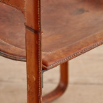 A pair of early leather clad side chairs by Matteo Grassi