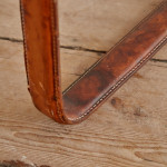 A pair of early leather clad side chairs by Matteo Grassi