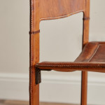 A pair of early leather clad side chairs by Matteo Grassi