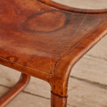 A pair of early leather clad side chairs by Matteo Grassi