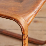 A pair of early leather clad side chairs by Matteo Grassi