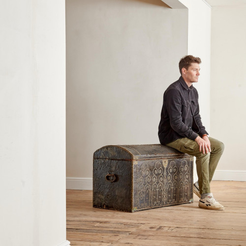 A black leather studded domed trunk