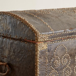 A black leather studded domed trunk