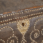 A black leather studded domed trunk