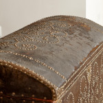 A black leather studded domed trunk
