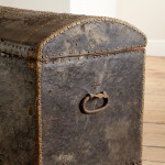 A black leather studded domed trunk