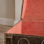 A black leather studded domed trunk