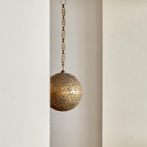 A large brass shadow ball pendant