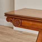 An unusual William IV satinwood veneered folding card table
