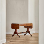A Regency brown oak sofa table